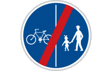 Dopravní značka „Konec stezky pro chodce a cyklisty dělené“ (č. C 10b) ukončuje platnost značky „Stezka pro chodce a cyklisty dělená“ (č. C 10a). TestImage